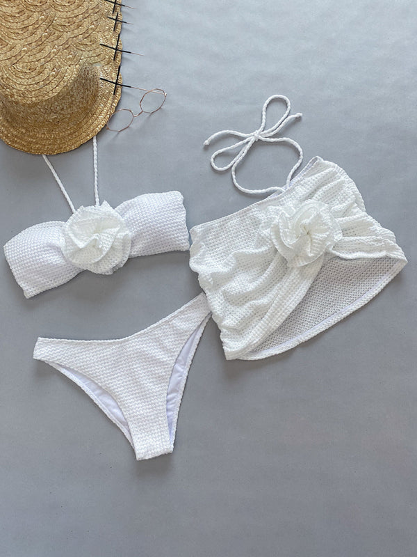 White 3-piece bikini set with floral bandeau top, high-cut bottoms, and skirt cover-up
